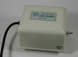 An air pump, used with the Japanese style of air-burning torches, for making glass beads